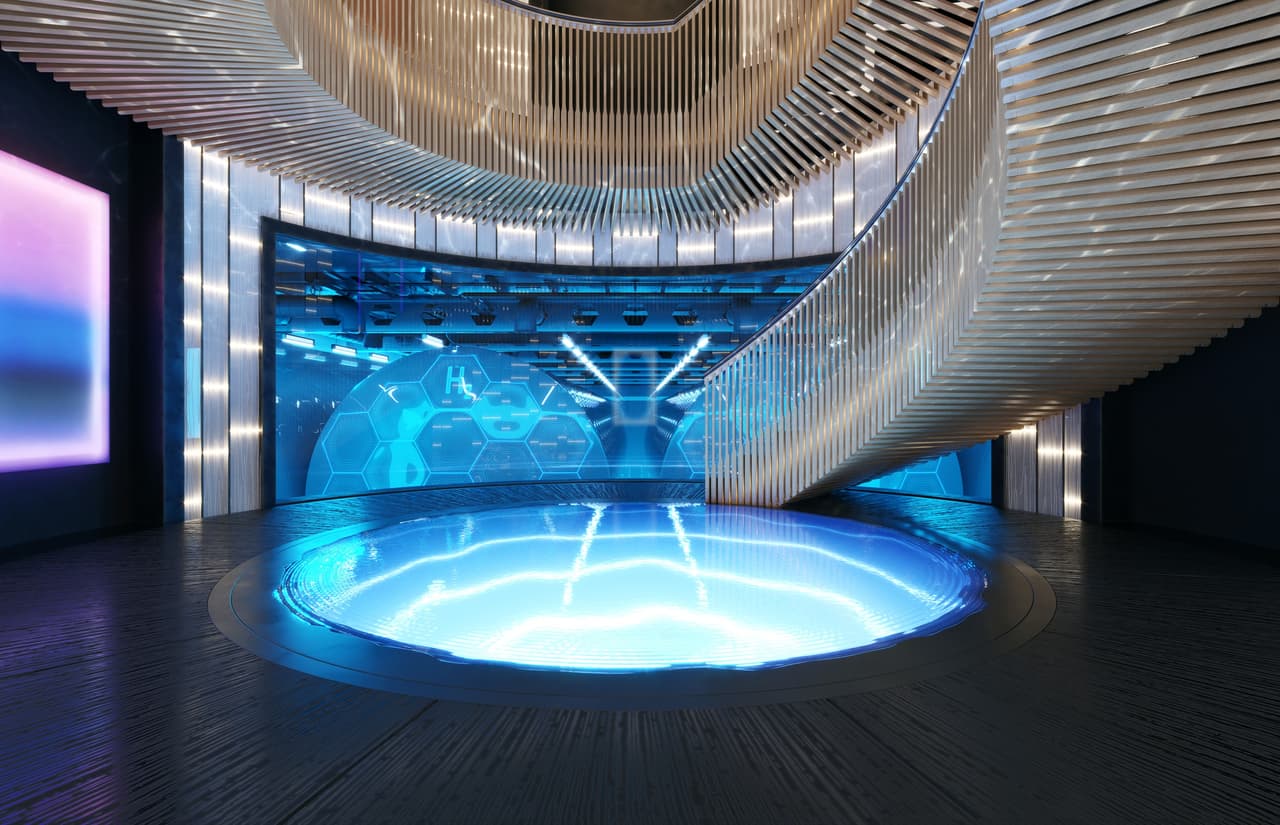 "La espectacular escalera circular, situada en el núcleo de Aqua, conecta las cubiertas superior e inferior y es una de las características definitorias del yate. Hacia la popa se ven los dos impresionantes tanques de hidrógeno con una superficie hexagonal, detrás de una fachada de vidrio reforzado", destacó.