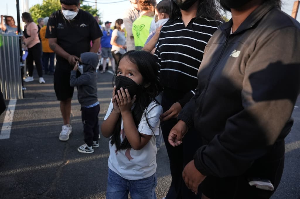 A child waits for their father to be released from Delaney Hall detention center Thursday, May 28, 2026, in Newark, N.J. (AP Photo/Angelina Katsanis)