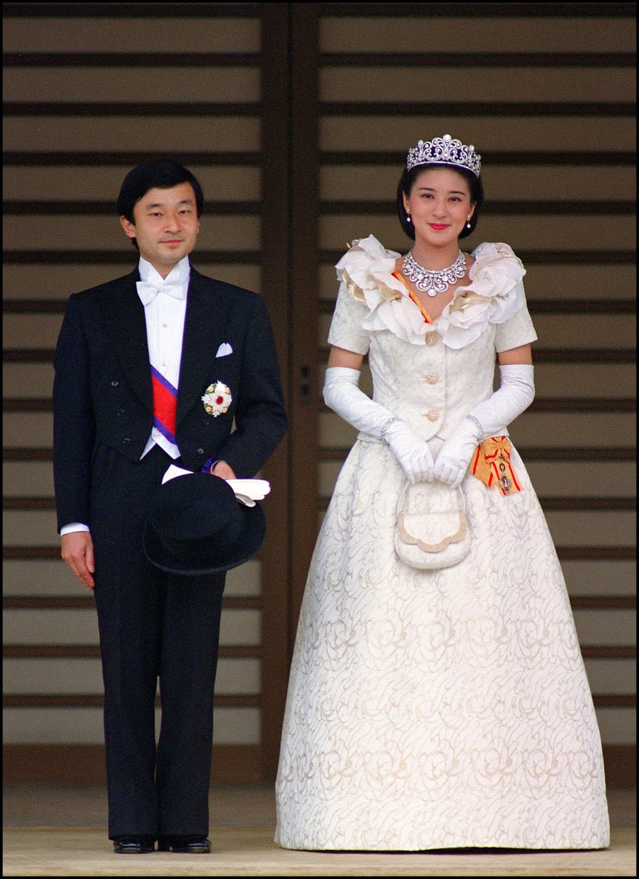 <b>1993 - Masako Owada and Prince Naruhito of Japan</b>
<br>After wearing a traditional kimono weighing over 14 kilos (31 pounds) for the private, sacred ceremony, the 
<a href="http://www.caras.com.mx/realeza/17/05/19/masako--la-princesa-que-no-queria-reinar/">new princess</a> changed into a white Western gown with a flared neckline, long gloves and a diamond diadem.