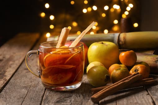 Traditional mexican hot christmas punch also called "ponche" with fruits