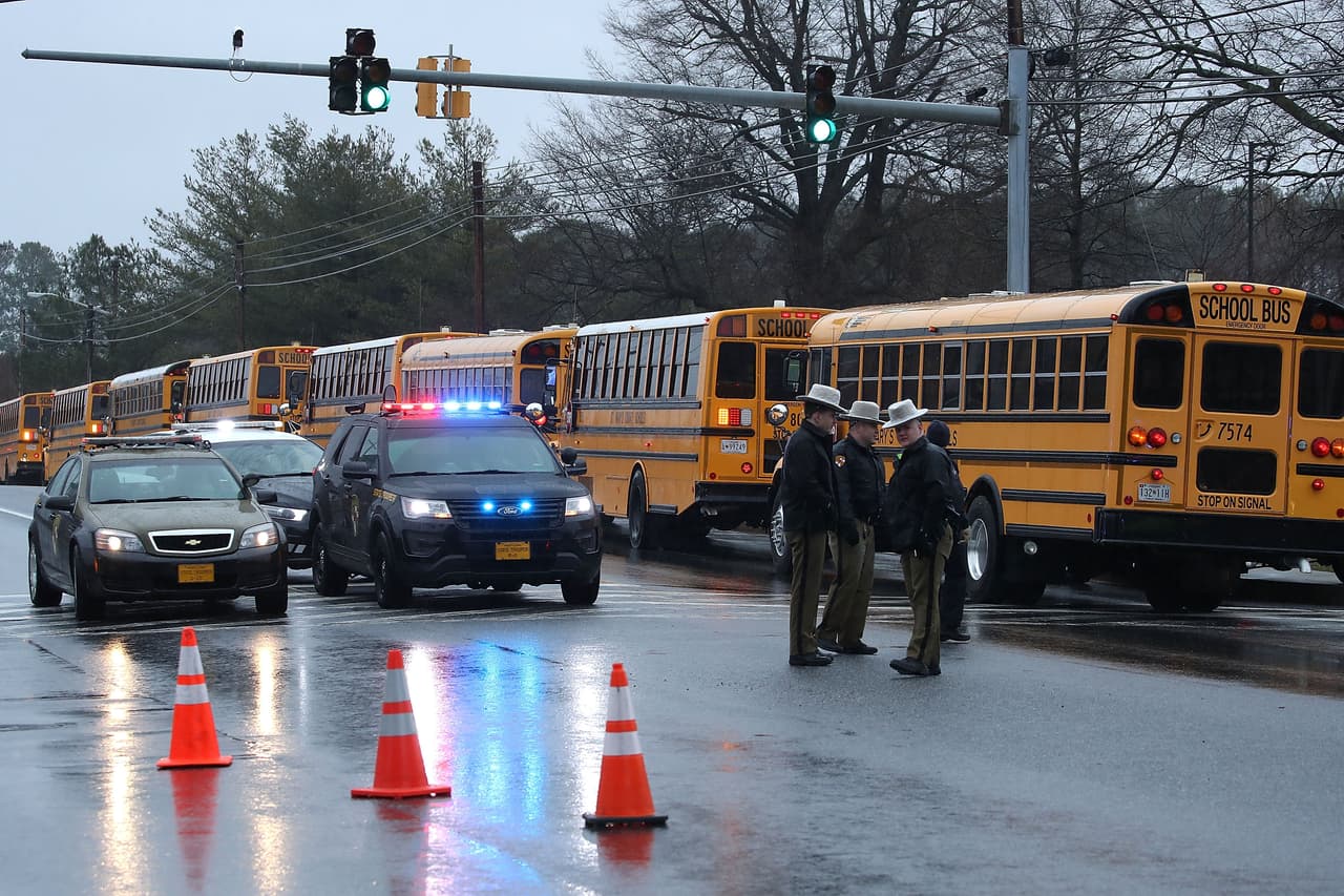 GREAT MILLS, MD - MARCH 20: School buses are lined up in front of Great Mills High School after a shooting on March 20, 2018 in Great Mills, Maryland. It was reported that two students at a Maryland high school were injured after a colleague opened fire in the hallway just before classes began. (Photo by Mark Wilson/Getty Images)