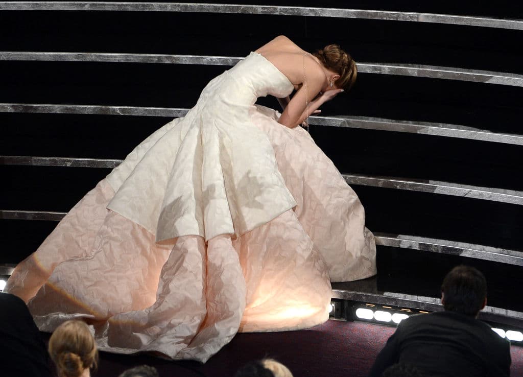 HOLLYWOOD, CA - FEBRUARY 24: Actress Jennifer Lawrence reacts after winning the Best Actress award for "Silver Linings Playbook" during the Oscars held at the Dolby Theatre on February 24, 2013 in Hollywood, California. (Photo by Kevin Winter/Getty Images)