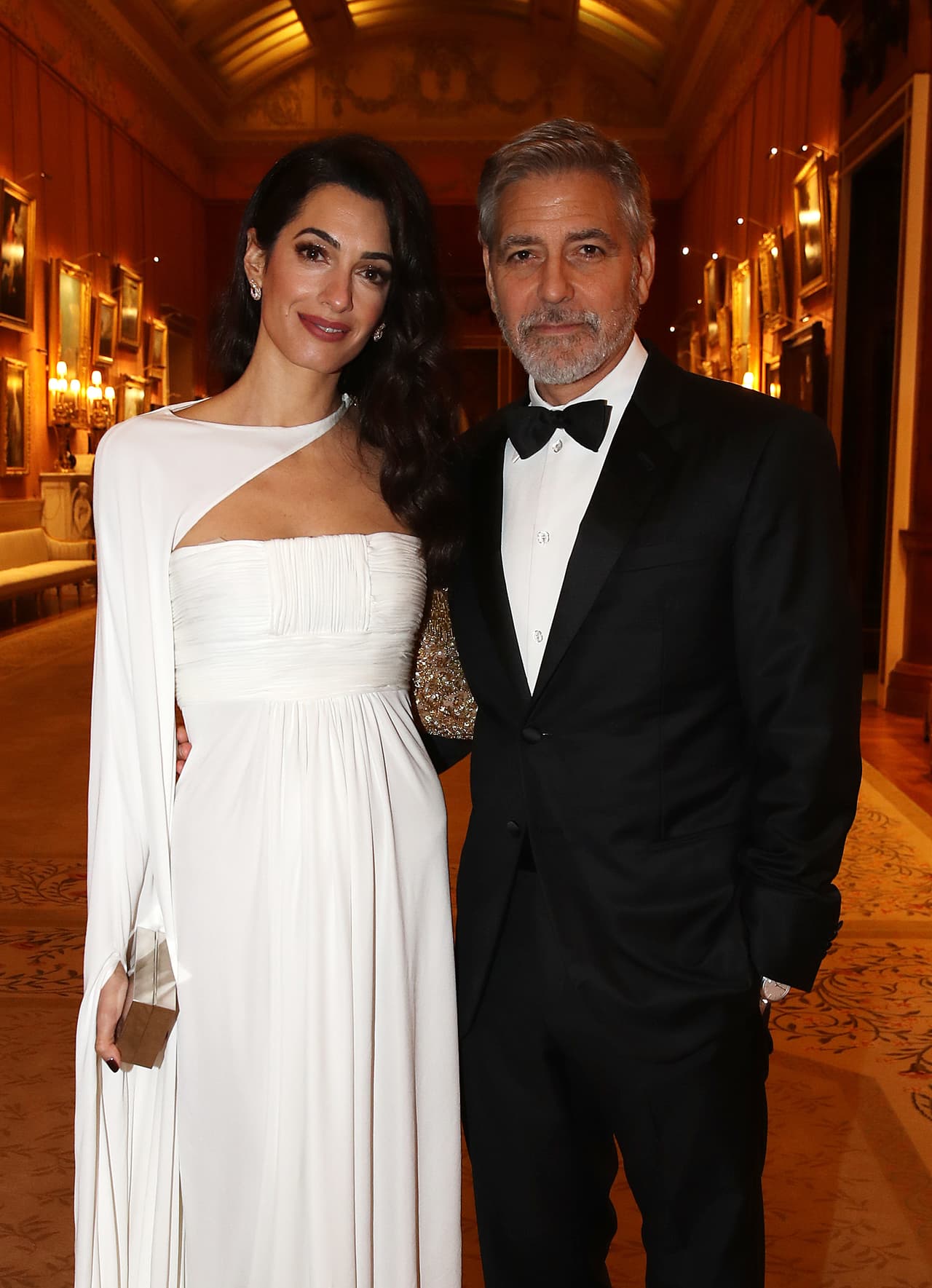 Este no es el primer evento real al que asisten George y Amal Clooney. La pareja, que tiene hijos gemelos, fueron parte de los 600 invitados a la boda de Meghan y Harry.