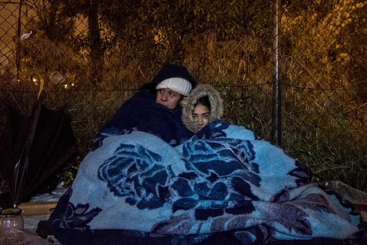Zulai Granados and her daughter Oriana, from Venezuela, sleep in the street near the immigration office in Madrid hoping to get a chance to file as asylum application.