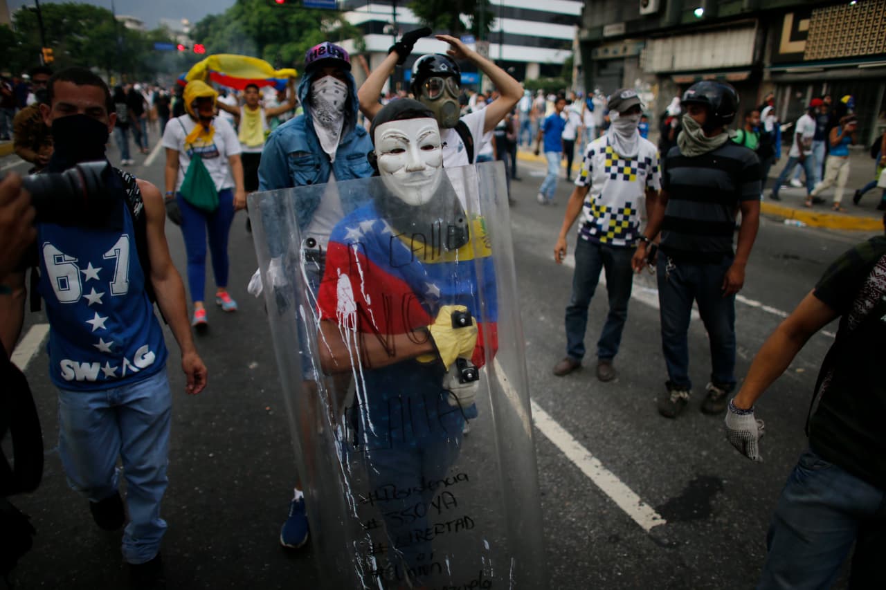 The mask that symbolizes the global radical group "Anonymous," is common among Venezuelan demonstrators.