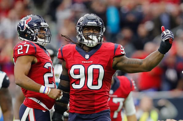 HOUSTON, TX - DECEMBER 18: Jadeveon Clowney #90 of the Houston Texans celebrates with Quintin Demps #27 of the Houston Texans after a tackle in the fourth quarter against the Jacksonville Jaguars at NRG Stadium on December 18, 2016 in Houston, Texas. (Photo by Tim Warner/Getty Images)