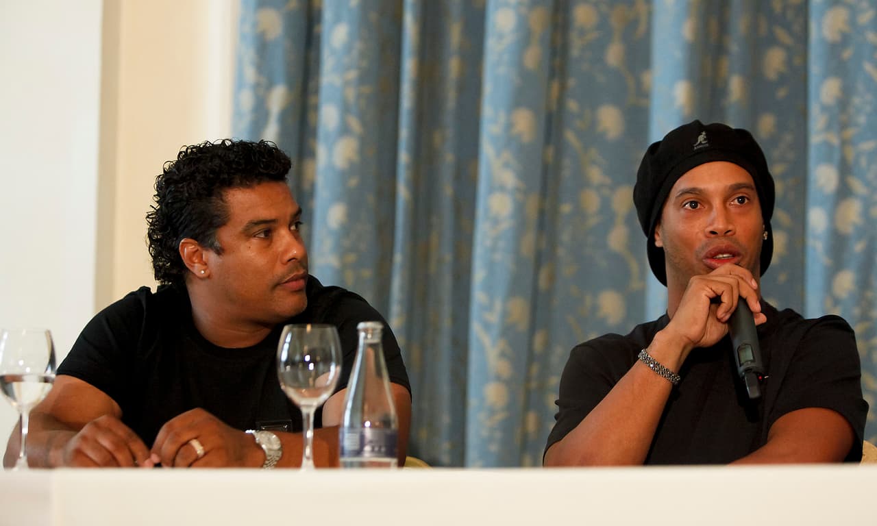 RIO DE JANEIRO, BRAZIL - JANUARY 06: Brazilian soccer player Ronaldinho Gaucho of AC Milan speaks alongside his brother Assis (L) during a press conference about his club for 2011 at Copacabana Palace Hotel on January 6, 2011 in Rio de Janeiro, Brazil. (Photo by Buda Mendes /LatinContent/Getty Images)