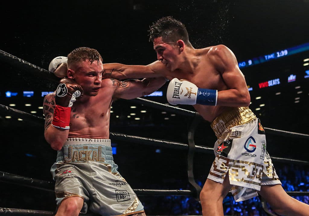 NEW YORK, NY - JULY 30: Leo Santa Cruz of Mexico (gold trunks) fights Carl Frampton of Northern Ireland (blue trunks) during their 12 round WBA Super featherweight championship bout at Barclays Center on July 30, 2016 in the Brooklyn borough in New York City. (Photo by Anthony Geathers/Getty Images)