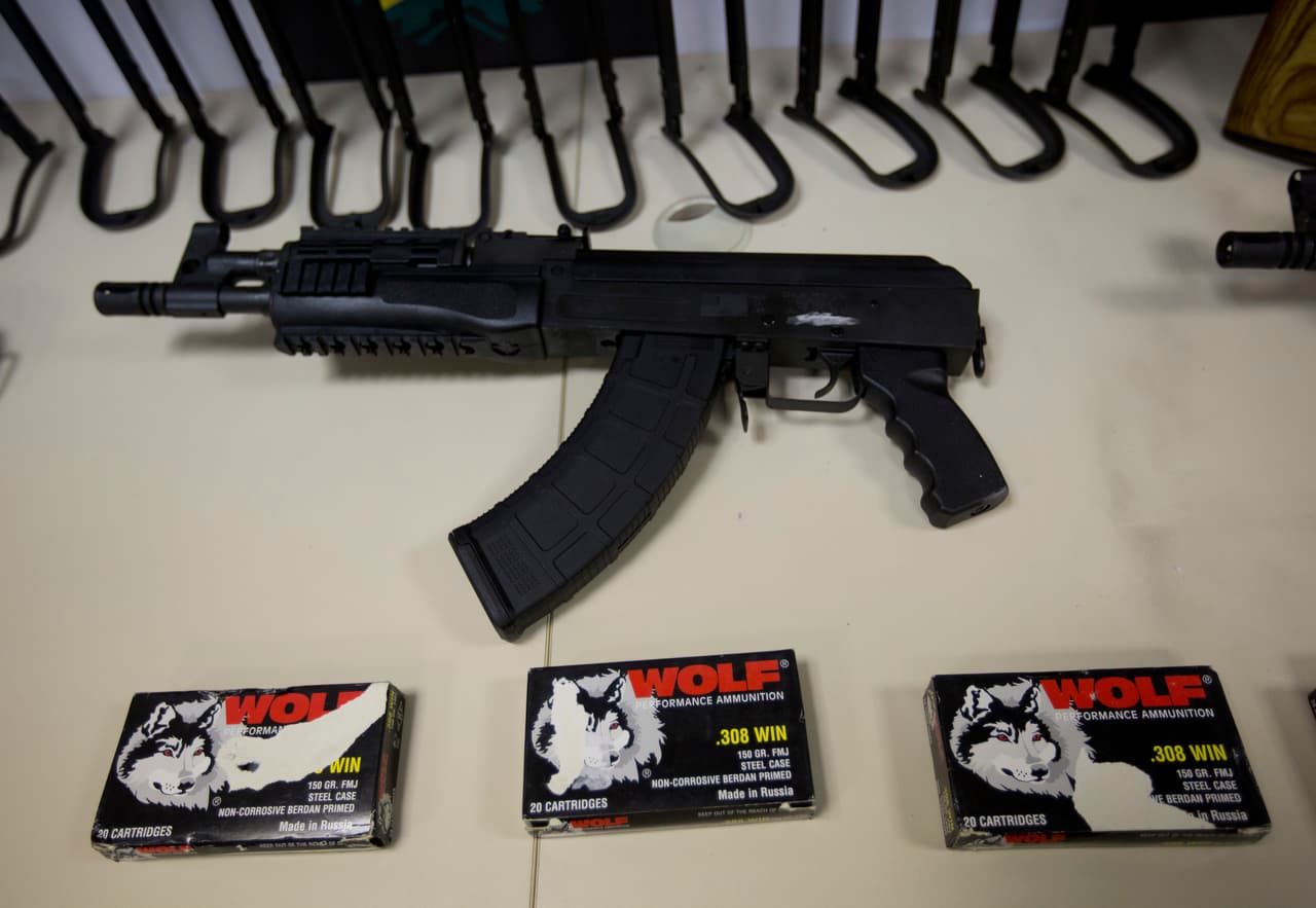 Police show confiscated automatic rifles during a press conference in Rio de Janeiro, Brazil, Thursday, June 1, 2017. Brazilian police say they confiscated 60 automatic rifles found in a cargo shipment at Rio de Janeiro's international airport. The weapons were found Thursday in a container with pool heaters in a shipment from Miami, and four people have been arrested. (AP Photo/Silvia Izquierdo)