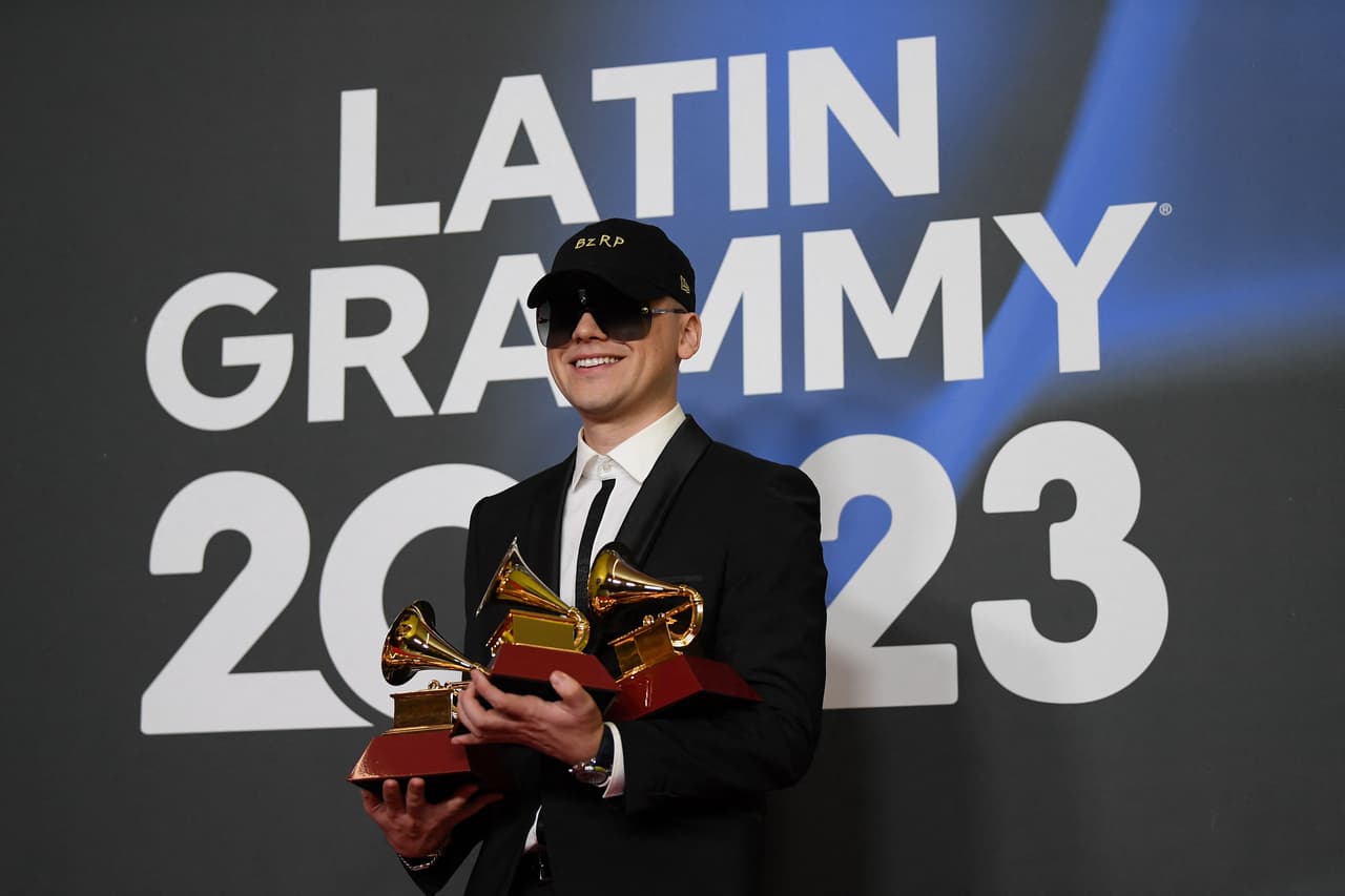 Argentinian DJ and record producer Bizarrap poses with his Record of the Year and Best Urban Song Awards during the 24th Annual Latin Grammy Awards ceremony at the Conference and Exhibition Centre (FIBES) in Sevilla on November 16, 2023. The Annual Latin Grammy Awards ceremony takes place for the first time out of US, gathering the most popular artists of the Latin world at the Conference and Exhibition Centre (FIBES) in Sevilla. (Photo by JORGE GUERRERO / AFP) (Photo by JORGE GUERRERO/AFP via Getty Images)