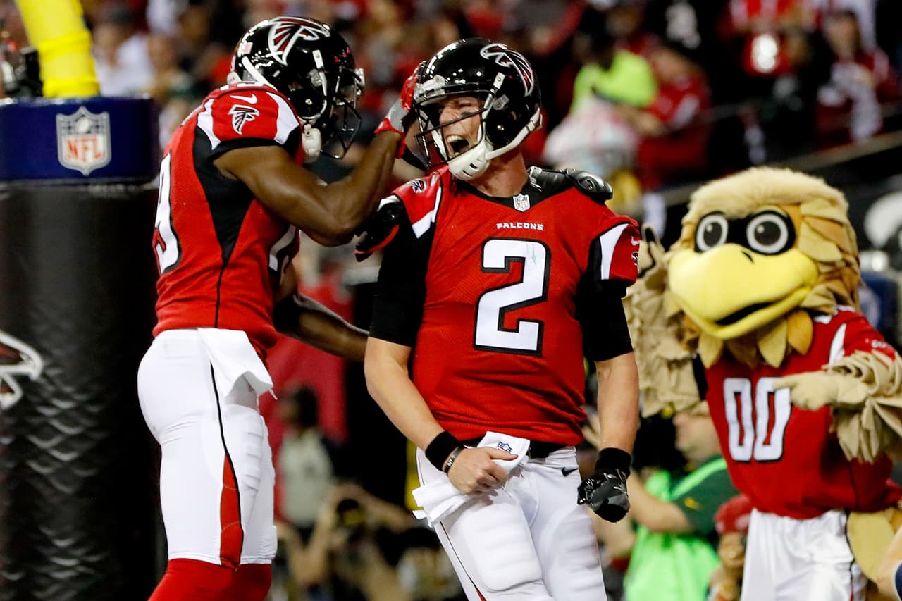 ATLANTA, GA - JANUARY 22: Matt Ryan #2 of the Atlanta Falcons celebrates with Aldrick Robinson #19 after a 14 yard touchdown run in the second quarter against the Green Bay Packers in the NFC Championship Game at the Georgia Dome on January 22, 2017 in Atlanta, Georgia. (Photo by Kevin C. Cox/Getty Images)