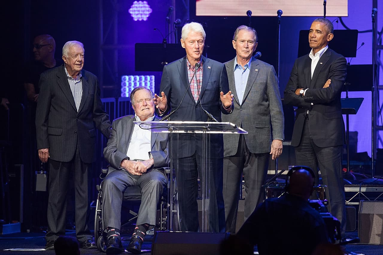 COLLEGE STATION, TX - OCTOBER 21: (L-R) Former United States Presidents Jimmy Carter, George H.W. Bush, Bill Clinton, George W. Bush, and Barack Obama address the audience during the 'Deep from the Heart: The One America Appeal Concert' at Reed Arena on the campus of Texas A&M University on October 21, 2017 in College Station, Texas. (Photo by Rick Kern/Getty Images for Ford Motor Company)