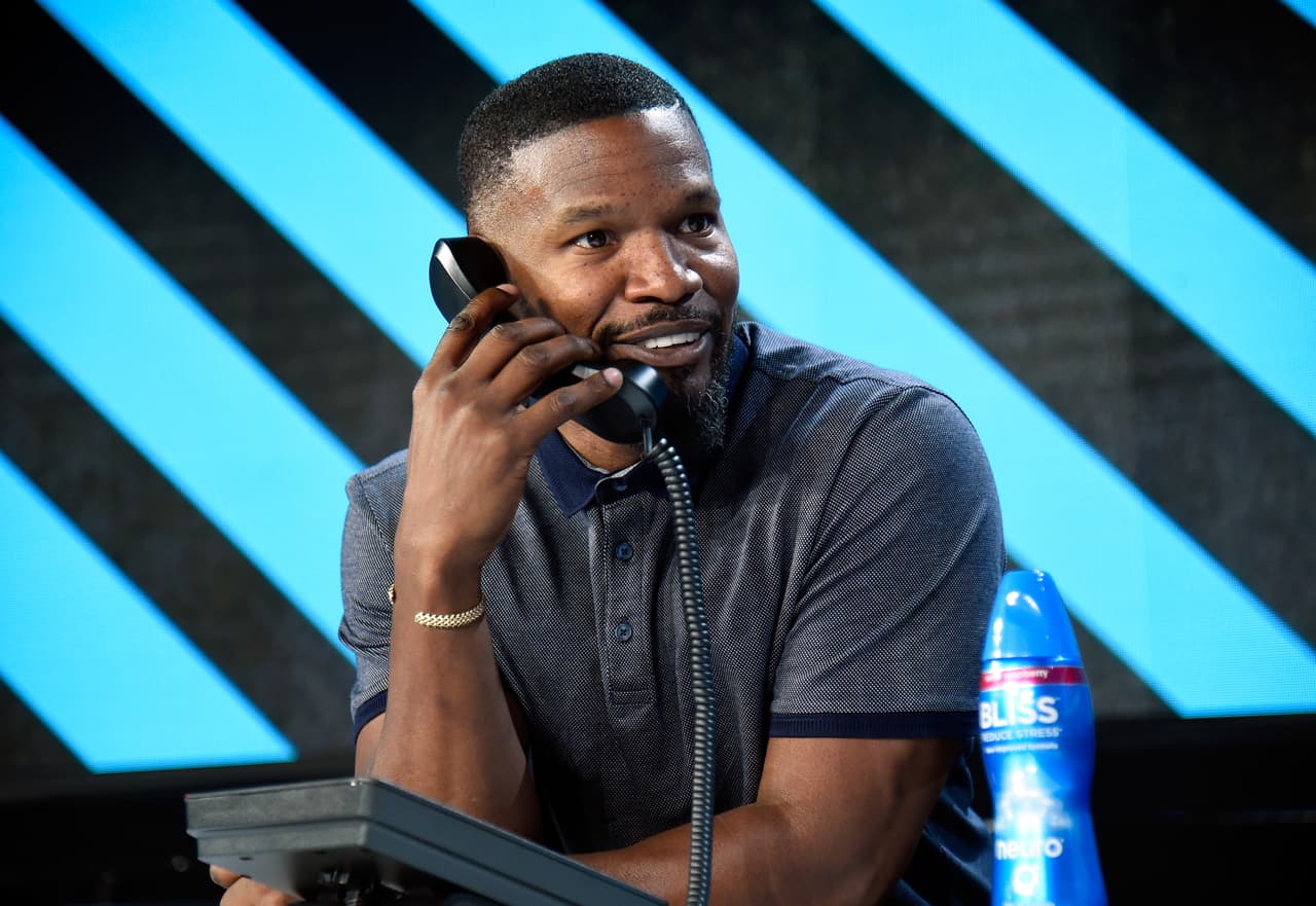 LOS ANGELES, CA - OCTOBER 14: In this handout photo provided by One Voice: Somos Live!, actor Jamie Foxx participates in the phone bank onstage during "One Voice: Somos Live! A Concert For Disaster Relief" at the Universal Studios Lot on October 14, 2017 in Los Angeles, California. (Photo by Kevin Mazur/One Voice: Somos Live!/Getty Images)