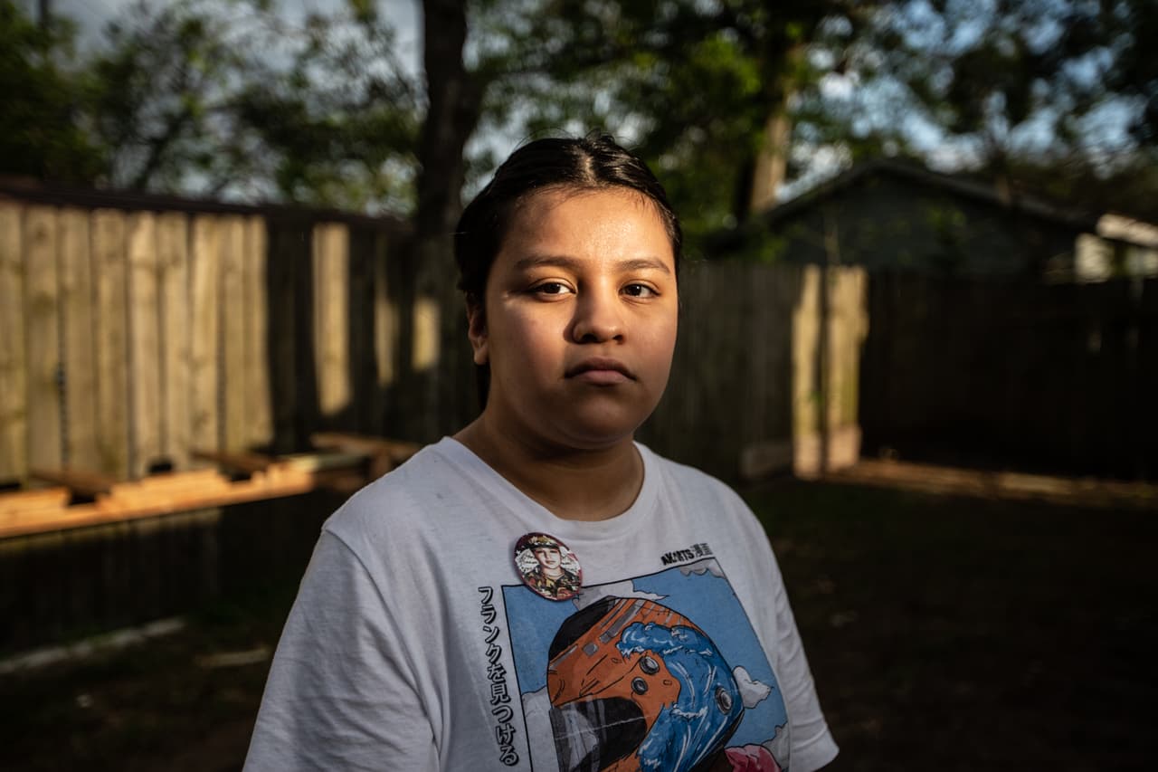Lupe Guiillen, 17, in the back garden of the family home in Houston, Texas.
<br>