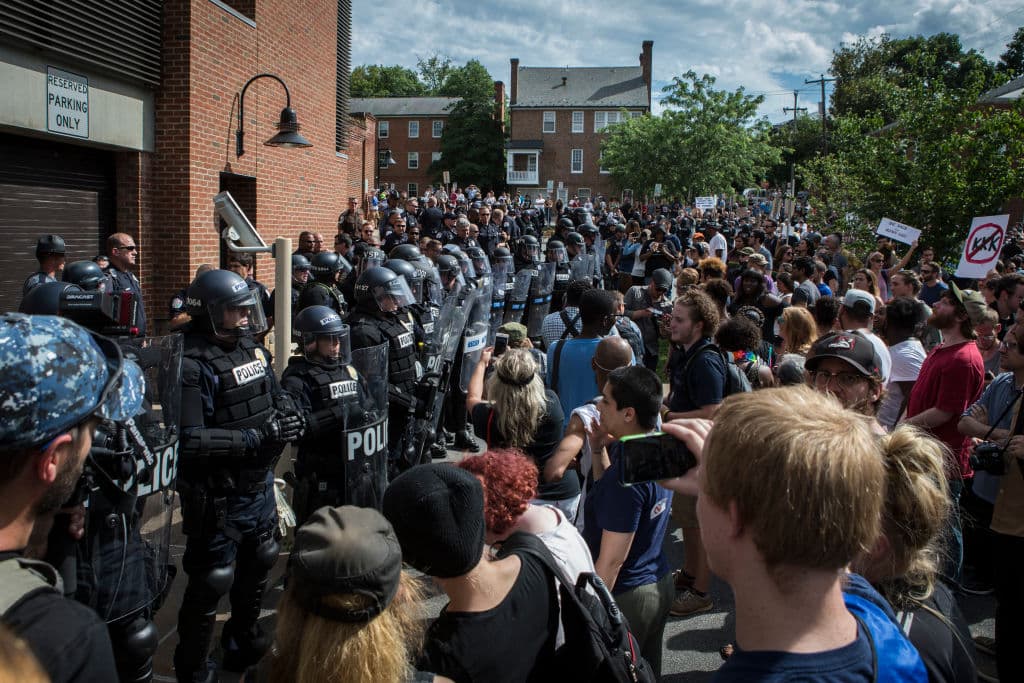 Counterprotesters shouted at participants in the KKK protest, and a large group of law enforcement officials, including members of the state police, established security lines.
