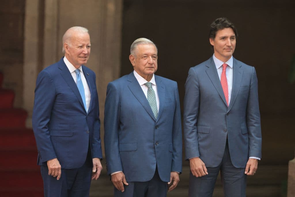 Mexican President Andres Manuel Lopez Obrador (C) stands next to US President Joe Biden (L) and Canada's Prime Minister Justin Trudeau, in Mexico City, on January 10, 2023. - The three leaders are meeting for a regional summit, with migration, trade and climate change set to be at the top of the agenda. (Photo by NICOLAS ASFOURI / AFP) (Photo by NICOLAS ASFOURI/AFP via Getty Images)