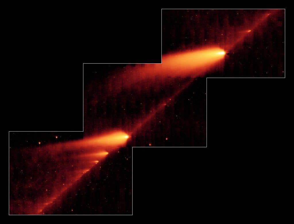 Esta imagen infrarroja del telescopio espacial Spitzer de la NASA muestra el cometa roto 73P/Schwassman-Wachmann 3 deslizándose a lo largo de un rastro de escombros dejados durante sus múltiples viajes alrededor del sol. Los objetos parecidos a llamas son los fragmentos del cometa y sus colas, mientras que el rastro polvoriento del cometa es la línea que une los fragmentos.