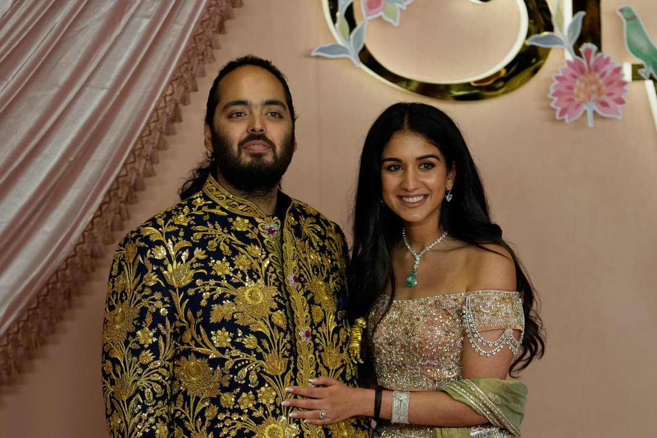Ambani's youngest son Anant Ambani and Radhika Merchant pose for a picture during their pre-wedding ceremony in Mumbai, India, Friday, July 5, 2024. (AP Photo/Rajanish Kakade)