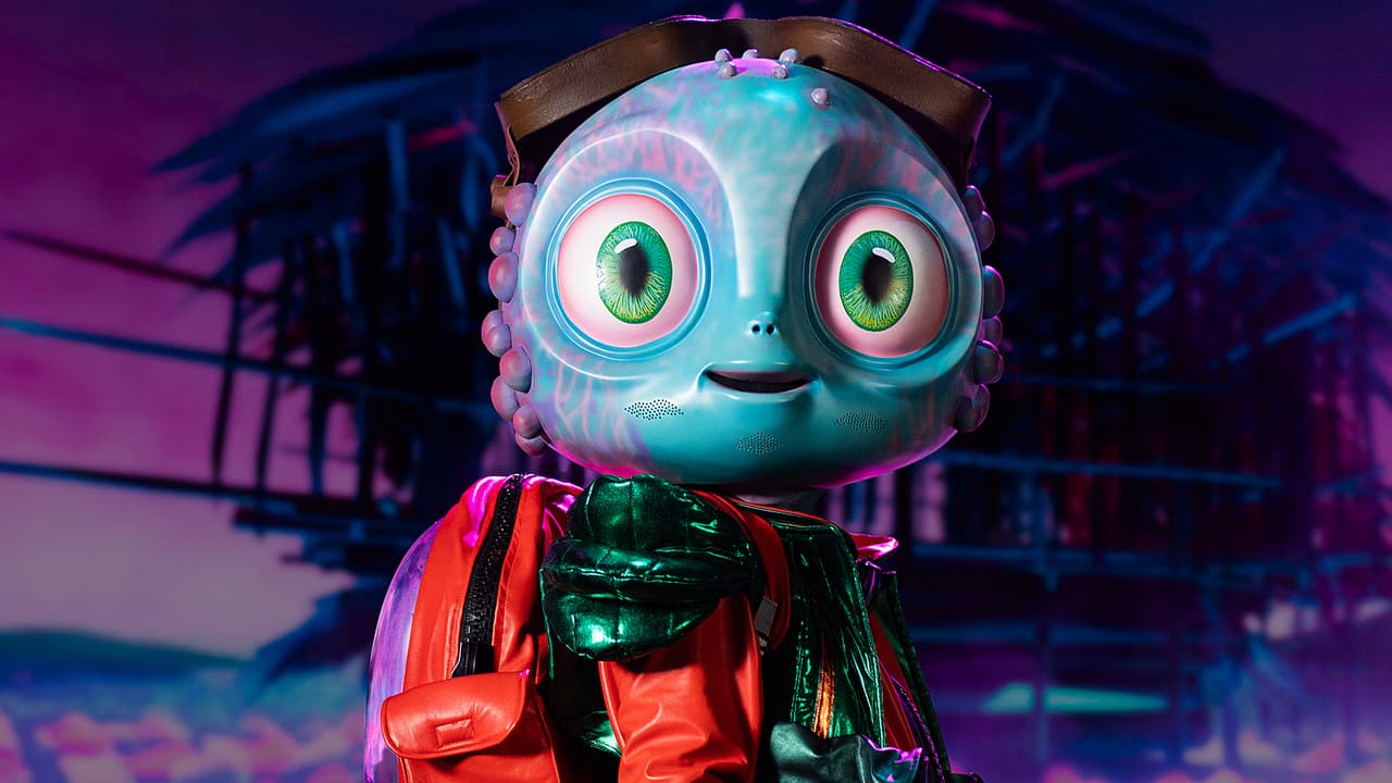 <h2 class="cms-H2-H2">Bebé Alien</h2>
<br>De carácter amistoso y alegre, es un aventurero galáctico que viaja a mundos desconocidos. Vive en la Tierra, en su colorida casa flotante y estudia culturas terrestres. Trasciende barreras idiomáticas con excentricidades cósmicas.
<br>