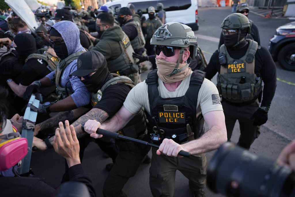Federal immigration officers confront protesters outside Delaney Hall detention center Thursday, May 28, 2026, in Newark, N.J. (AP Photo/Angelina Katsanis)