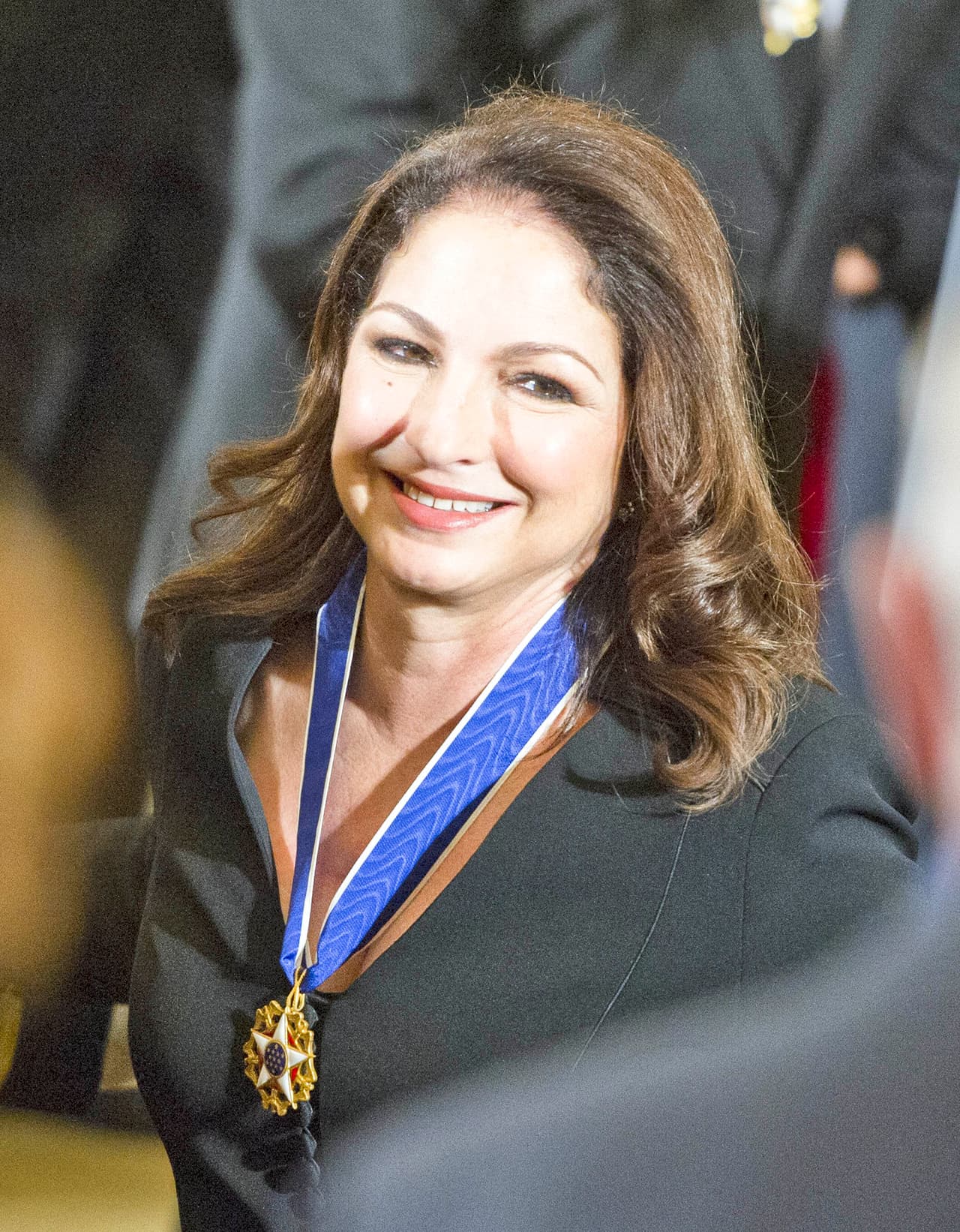 Gloria lució radiante con su medalla al cuello.