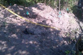 Hasta el 25 de octubre la PGR precisó que habían encontrado 11 fosas clandestinas.