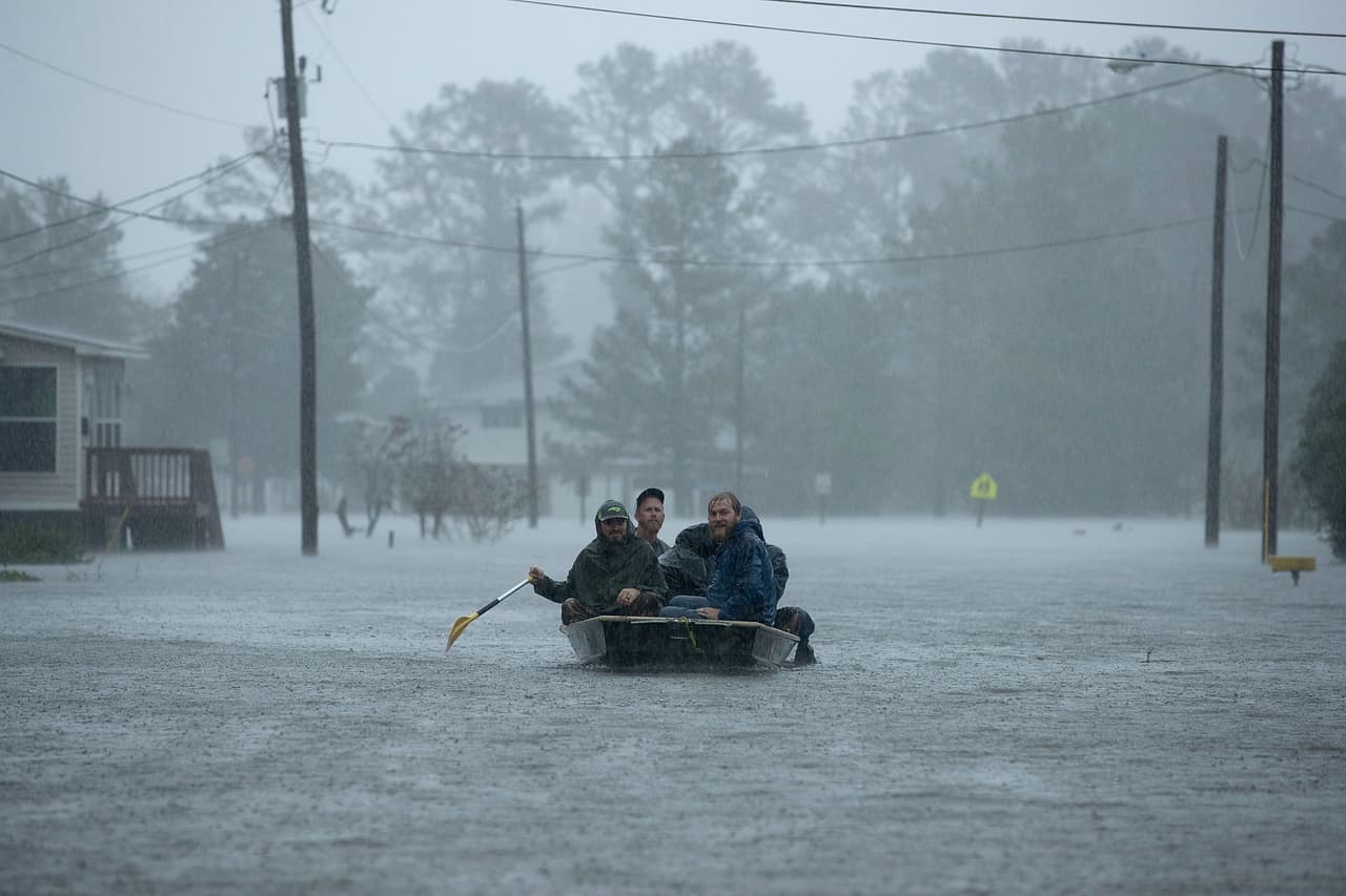 NEW BERN, NC - SEPTEMBER 14: Volunteers from all over North Carolina help rescue residents from their flooded homes during Hurricane Florence September 14, 2018 in New Bern, North Carolina. Hurricane Florence made landfall in North Carolina as a Category 1 storm and flooding from the heavy rain is forcing hundreds of people to call for emergency rescues in the area around New Bern, North Carolina, which sits at the confluence of the Nuese and Trent rivers. The storm has since been downgraded to a tropical storm. (Photo by Chip Somodevilla/Getty Images)