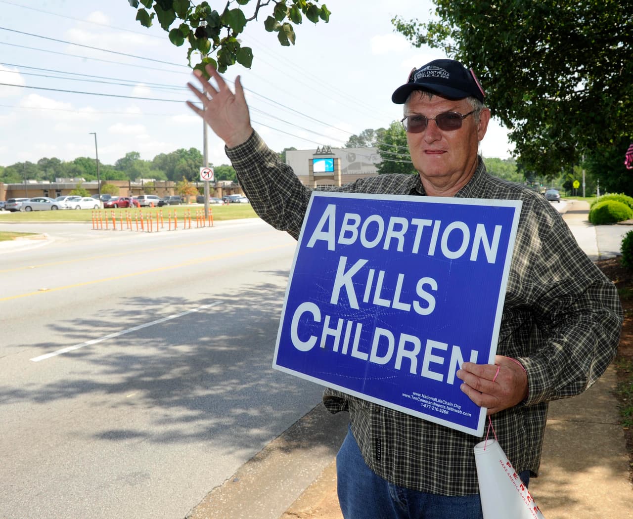 Jim Snively of Huntsville protests in front of the Alabama Women's Center, May 17, 2019. Protestors hold signs outside clinics, and sometimes insult patients and staff.