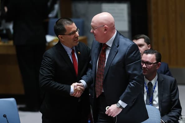 NEW YORK, USA - JANUARY 26 : Venezuela's Foreign Minister Jorge Arreaza (L) and Russian Ambassador to the United Nations Vasily Nebenzya (R) shake hands at the Security Council meeting on the situation in Venezuela, at the United Nations headquarters in New York, United States on January 26, 2019. (Photo by Atilgan Ozdil/Anadolu Agency/Getty Images)
