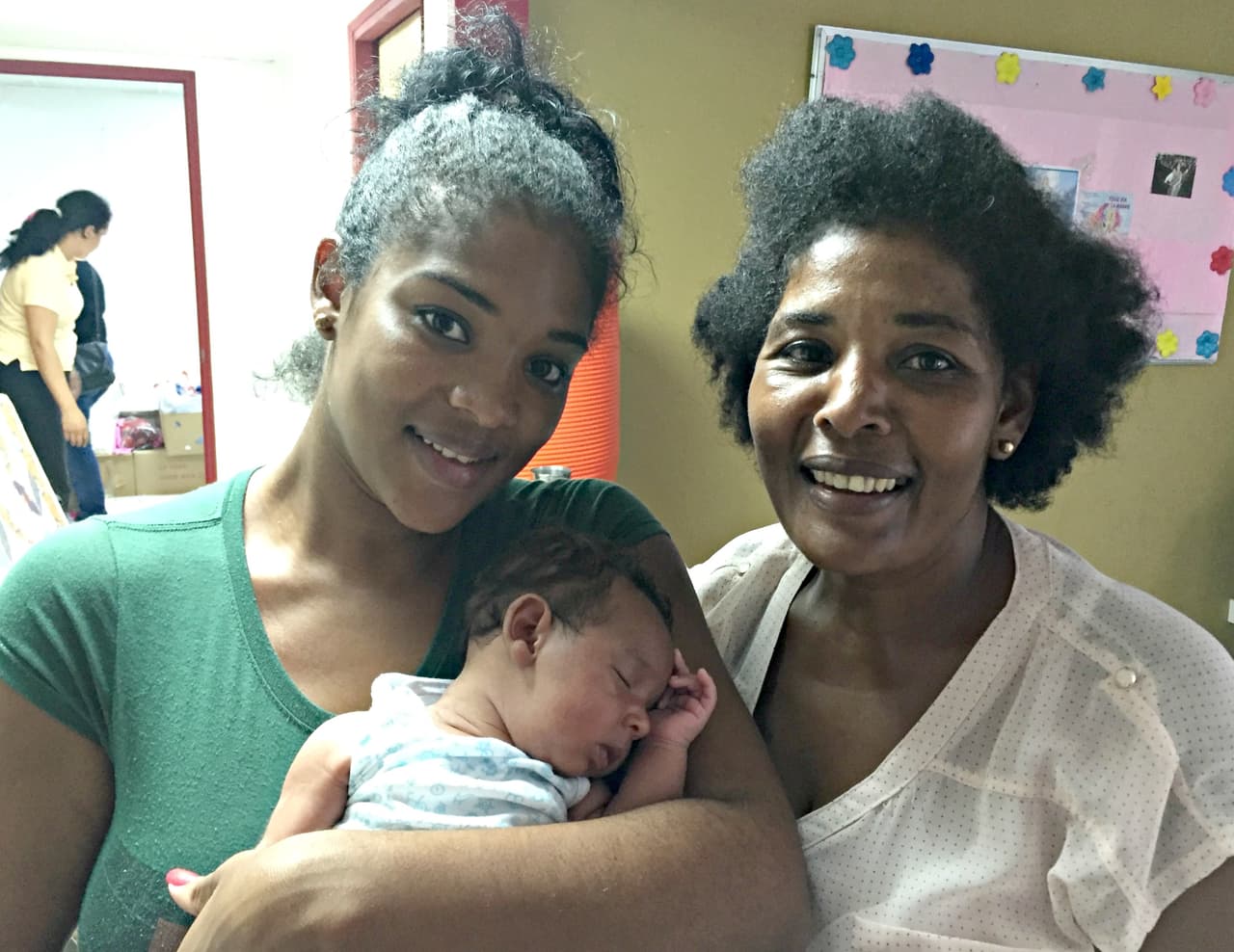 Aiderilis O'Farill 27, hiked across the Colombian border with Panama earlier this month only 17 days after giving birth to her son, Tahiler Hinojosa O’Farrill in Turbo, Colombia. They are being looked after with other Cuban migrants at a Caritas shelter in Panama City. Left to right; Aiderilis O'Farill (holding her baby) with her mother Arelis Alonso. Aug 28, 2016
<br>