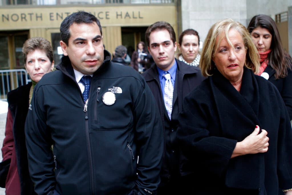 Patrick Orlando-Cachay, left, leaves Manhattan Supreme court after the arraignment of a man in New York accused or murdering his sister, Sylvie Cachay, a swimsuit designer, in a New York City hotel. January 11, 2011.