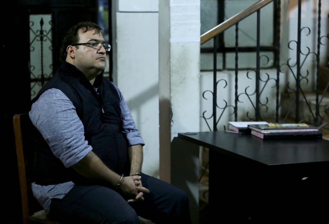Former governor Duarte in a police station in Guatemala after his arrest.