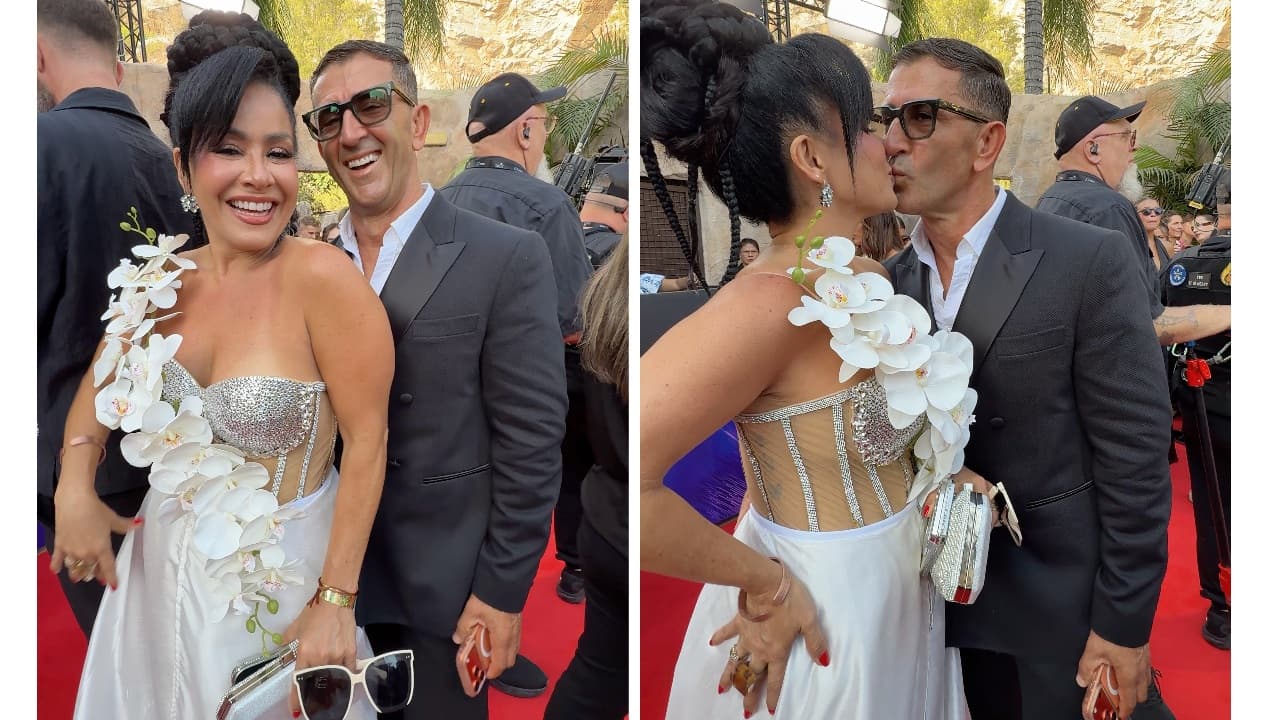 El beso de Carolina Sandoval y su novio Niko Topuzi.
