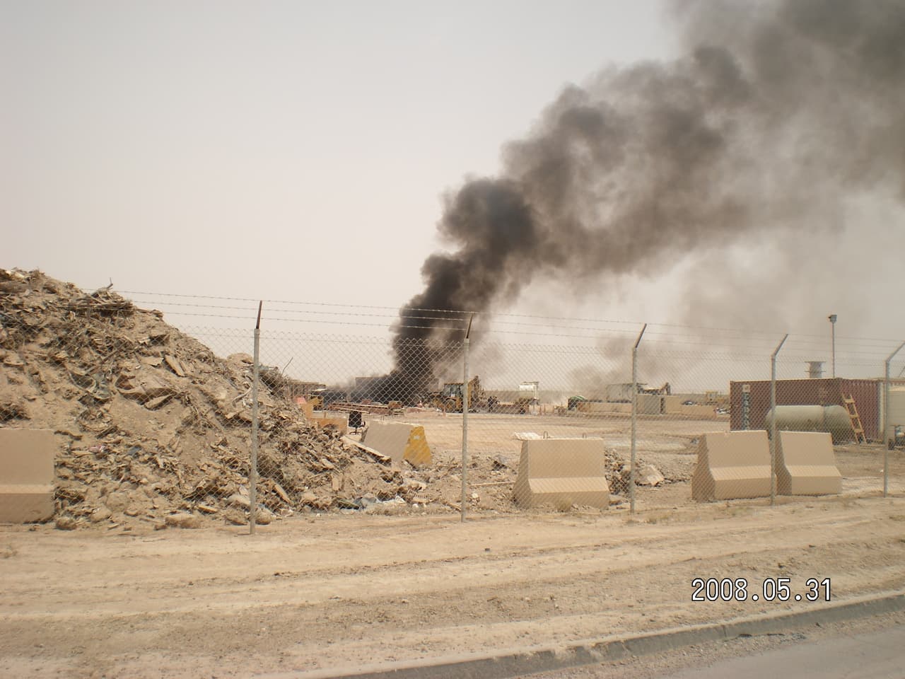 Photo of the open-air military waste burning pits at U.S. Army Joint Base Balad in Iraq. During its peak, the base hosted some 28,000 military personnel and more than 8,000 contractors and civilian employees.