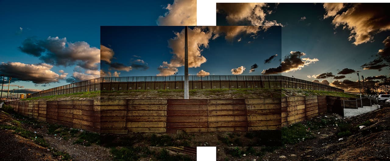 Double fence near 
<b>San Diego, California, on the Tijuana river.</b> This double fence stops migrants from using the Tijuana River as a smuggling corridor to enter the United States. In the 80s entire families whould try and cross hoping that sheer numbers would overwhelm the border patrol agents, allowing some of them to get across. This segment of the wall ended the so-called "banzai runs” [a World War Two phrase referring to the Japanese 'kamikaze' suicide pilots].