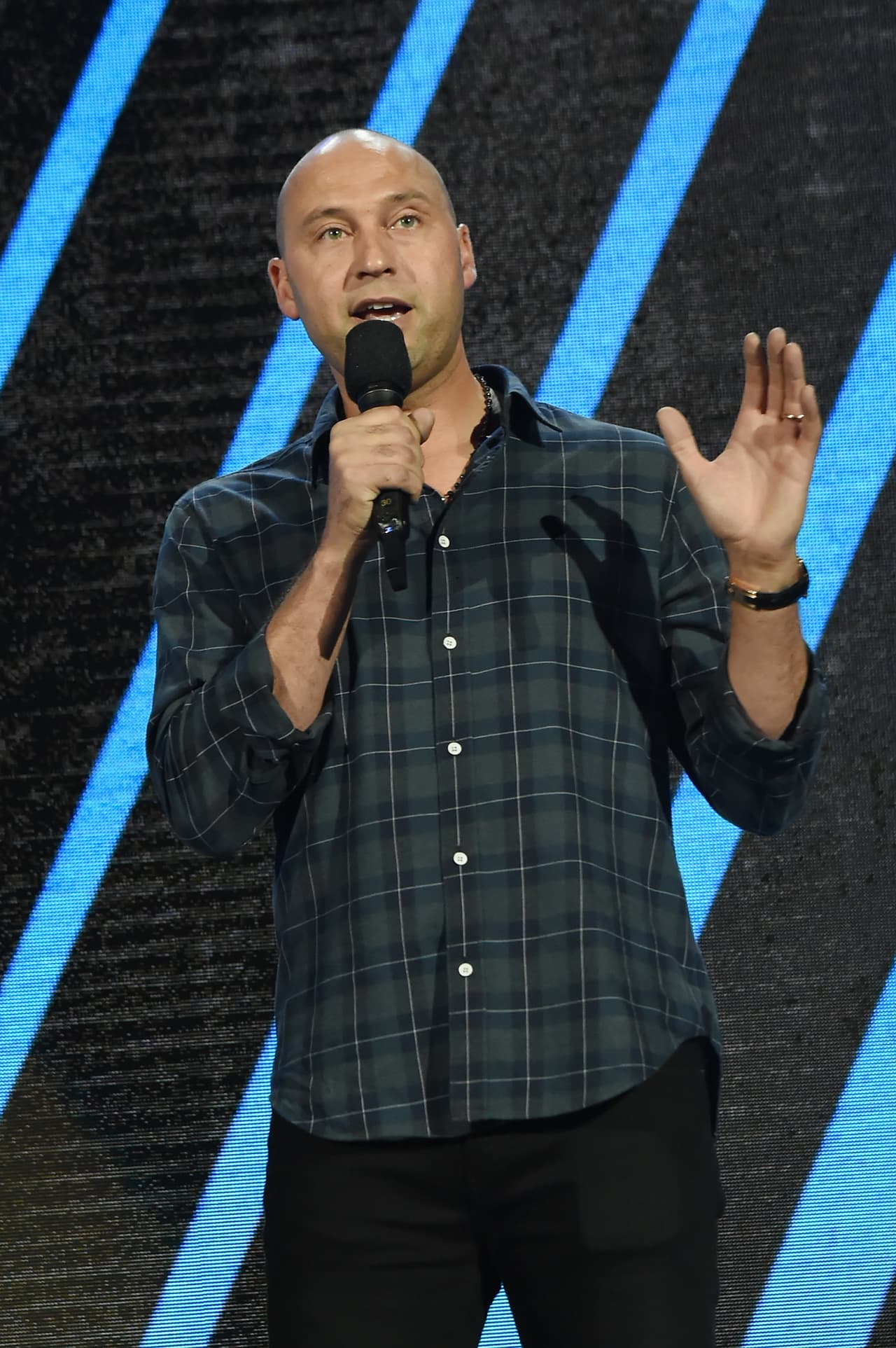 MIAMI, FL - OCTOBER 14: In this handout photo provided by One Voice: Somos Live!, Derek Jeter speaks onstage at One Voice: Somos Live! A Concert For Disaster Relief at Marlins Park on October 14, 2017 in Miami, Florida. (Photo by Rick Diamond/One Voice: Somos Live!/Getty Images)