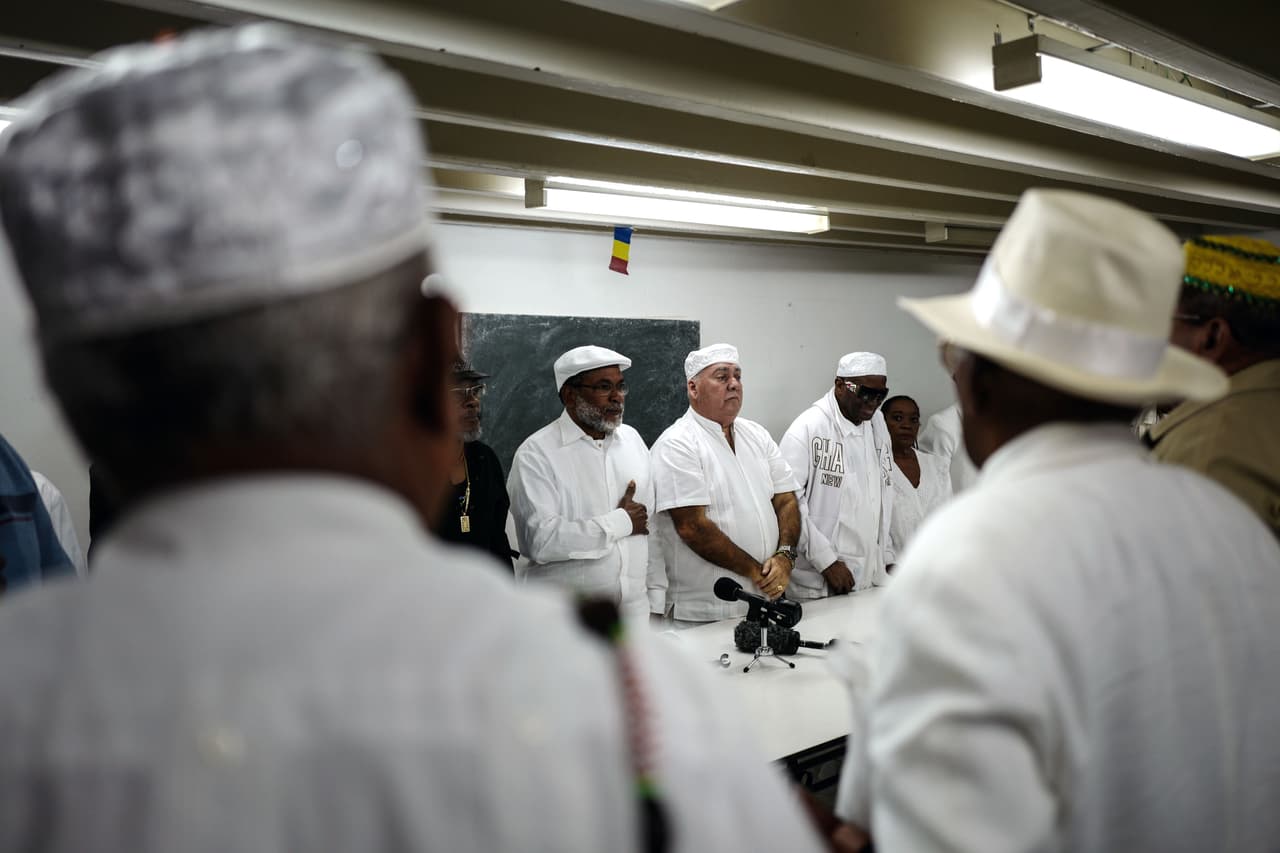 Afro-Cuban Yoruba religion priests give a press conference about the "Letter of the Year" which lists predictions made by Cuban Santeros for the new year, on January 02, 2018, in Havana. The babalawos (priests of Cuban Santeria) will pray this year to the Elegua deity, owner of the roads and destiny, to continue opening paths for the island, as they say she did in previous years. The prediction is made using the "Ifa Oracle", a complex and extensive divinatory system brought to America by the Yoruba slaves, which consists of 16 major signs and 240 possible combinations. / AFP PHOTO / ADALBERTO ROQUE (Photo credit should read ADALBERTO ROQUE/AFP/Getty Images)