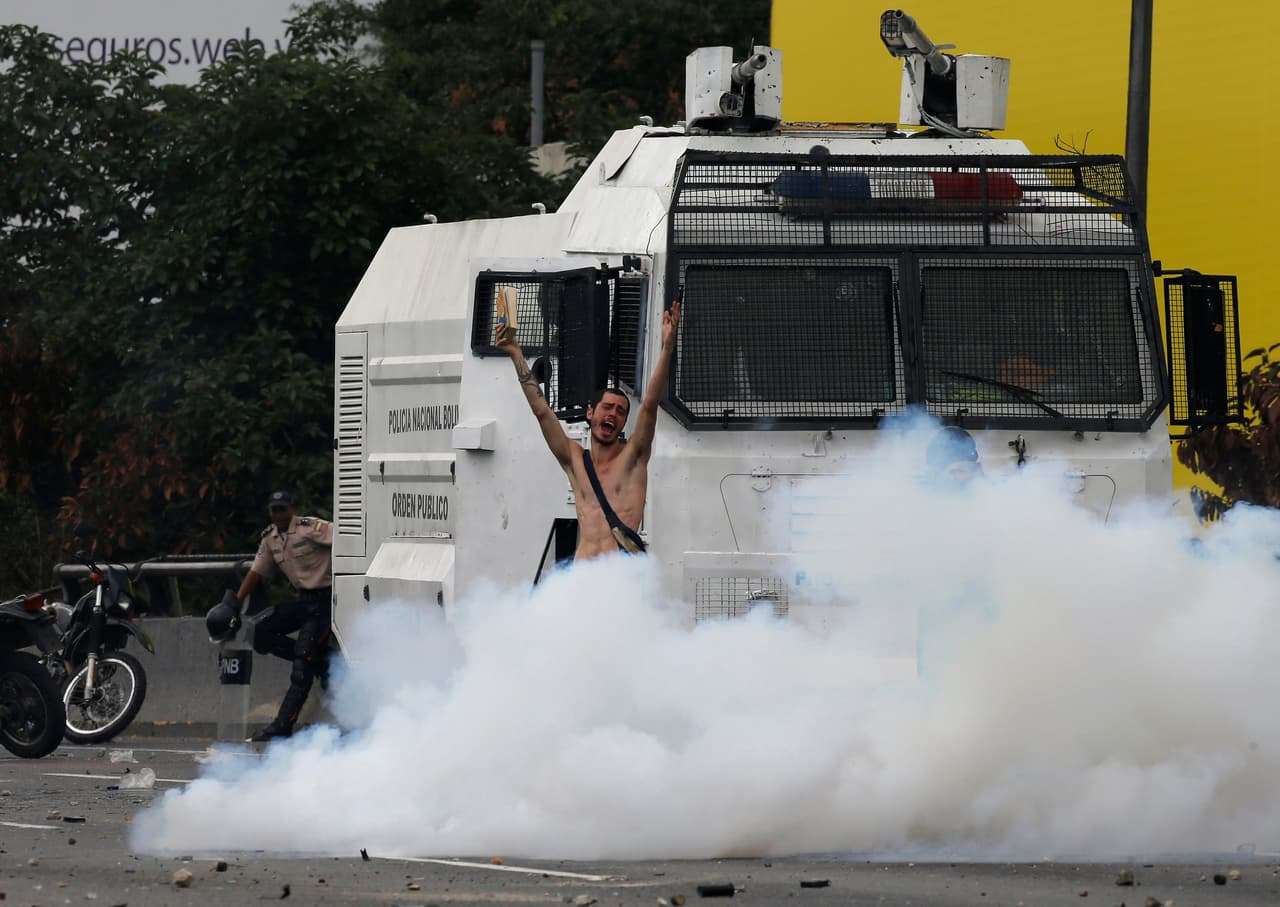 The young man asked for an end to the violence in the midst of persistent opposition protests against the government of President Nicolás Maduro. (Carlos García Rawlins/Reuters)