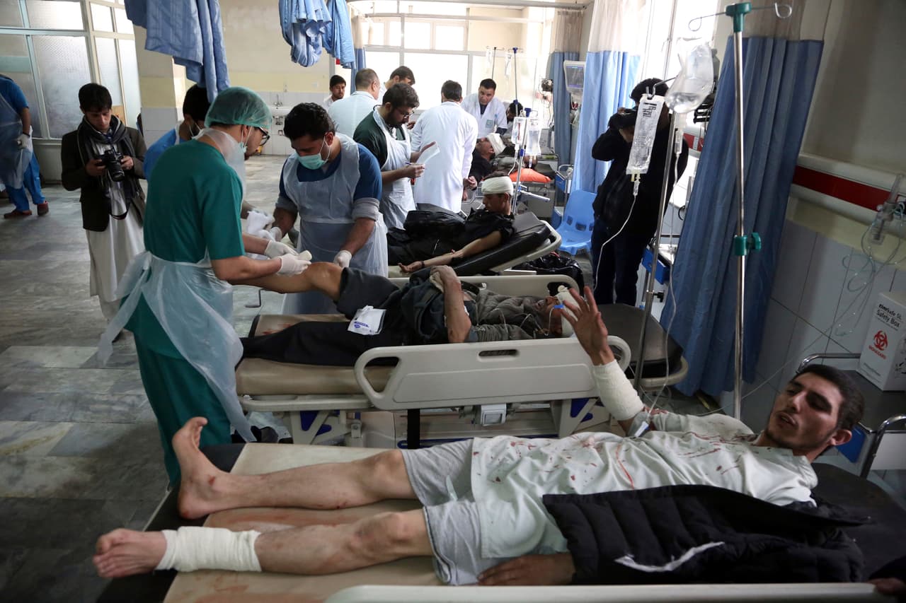 Afghan Injured men receives a treatment at a hospital after a suicide attack in Kabul, Afghanistan, Saturday Jan. 27, 2018. Authorities say suicide car bomber killed dozens of people and wounded over 100 in an attack claimed by the Taliban in the Afghan capital Kabul, authorities said. (AP Photo/ Rahmat Gul)
