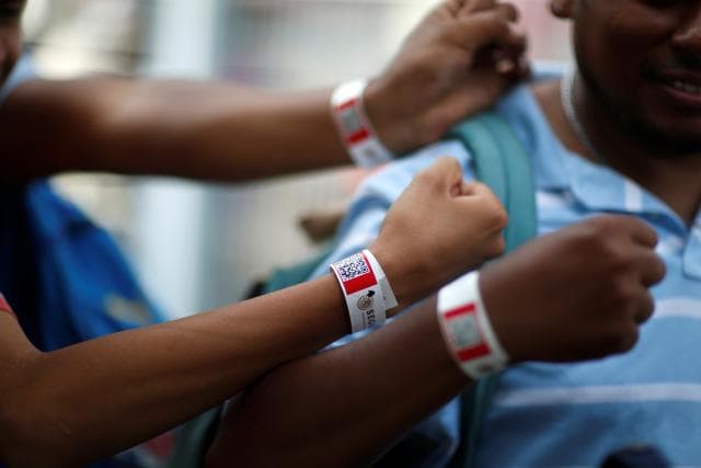 Once they reach Mexico, migration authorities give the migrants wristbands with a bar code with the data of their cases. "This is to claim the Mexican credential. They say that it's a one-year permit," says Henry Arce, 30, of Choloma, Honduras.
