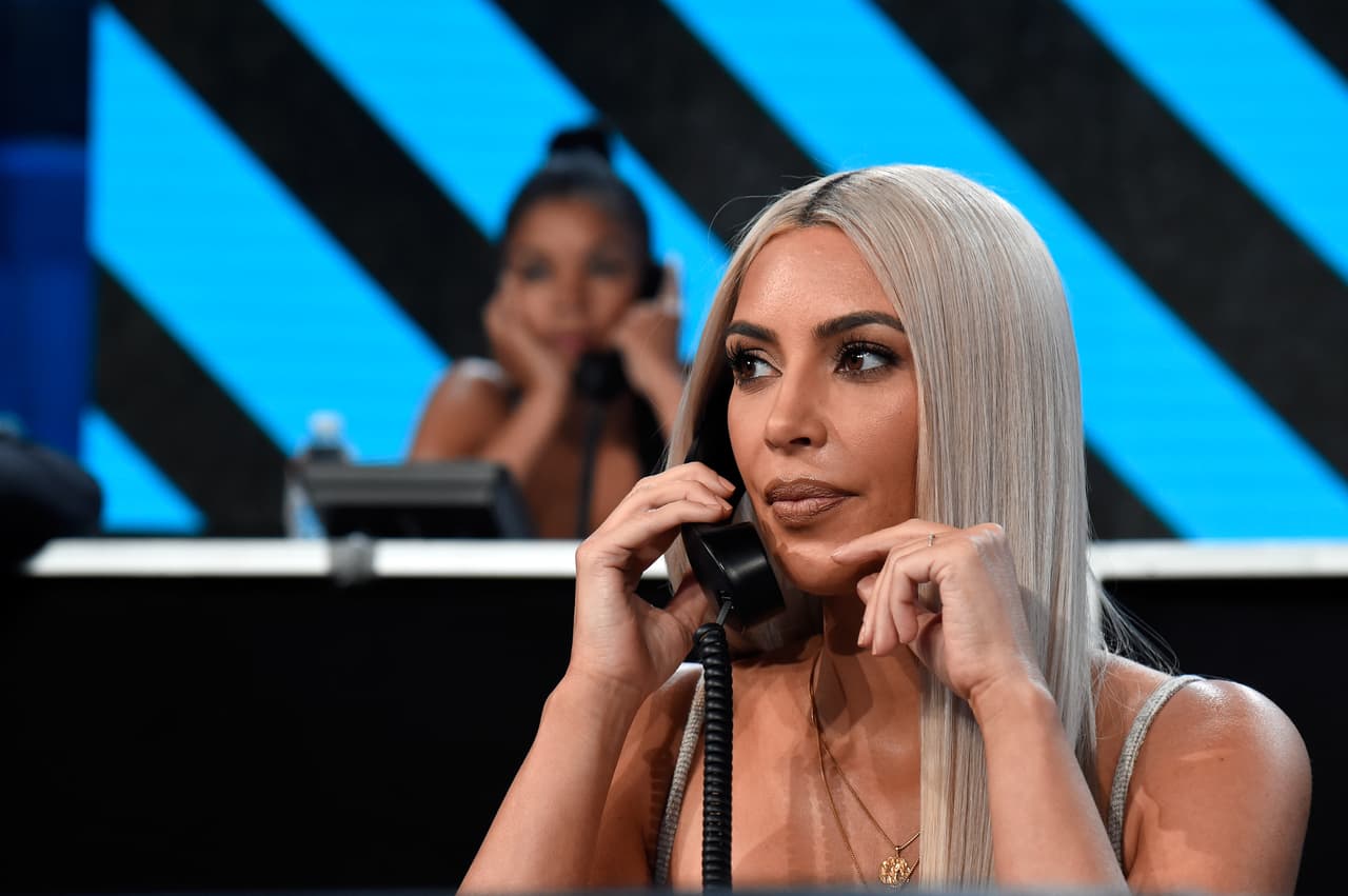 LOS ANGELES, CA - OCTOBER 14: In this handout photo provided by One Voice: Somos Live!, Kim Kardashian participates in the phone bank onstage during "One Voice: Somos Live! A Concert For Disaster Relief" at the Universal Studios Lot on October 14, 2017 in Los Angeles, California. (Photo by Kevin Mazur/One Voice: Somos Live!/Getty Images)