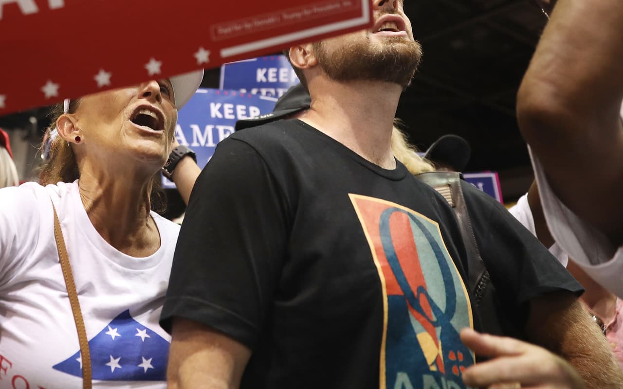 TAMPA, FL - JULY 31: A man wear a shirt with the words Q Anon as he attends a rally for President Donald Trump at the Make America Great Again Rally being held in the Florida State Fair Grounds Expo Hall on July 31, 2018 in Tampa, Florida. Some people attending either wore shirts with a Q or held signs with a Q and are reported to be part of a conspiracy theory group. (Photo by Joe Raedle/Getty Images)