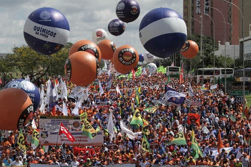 Demonstrators take part in a protest against Brazil's President Michel Temer in Brasilia, Brazil, Wednesday, May 24, 2017. Temer's attempt to win back confidence and stay in power was undermined Tuesday as one aide was arrested.