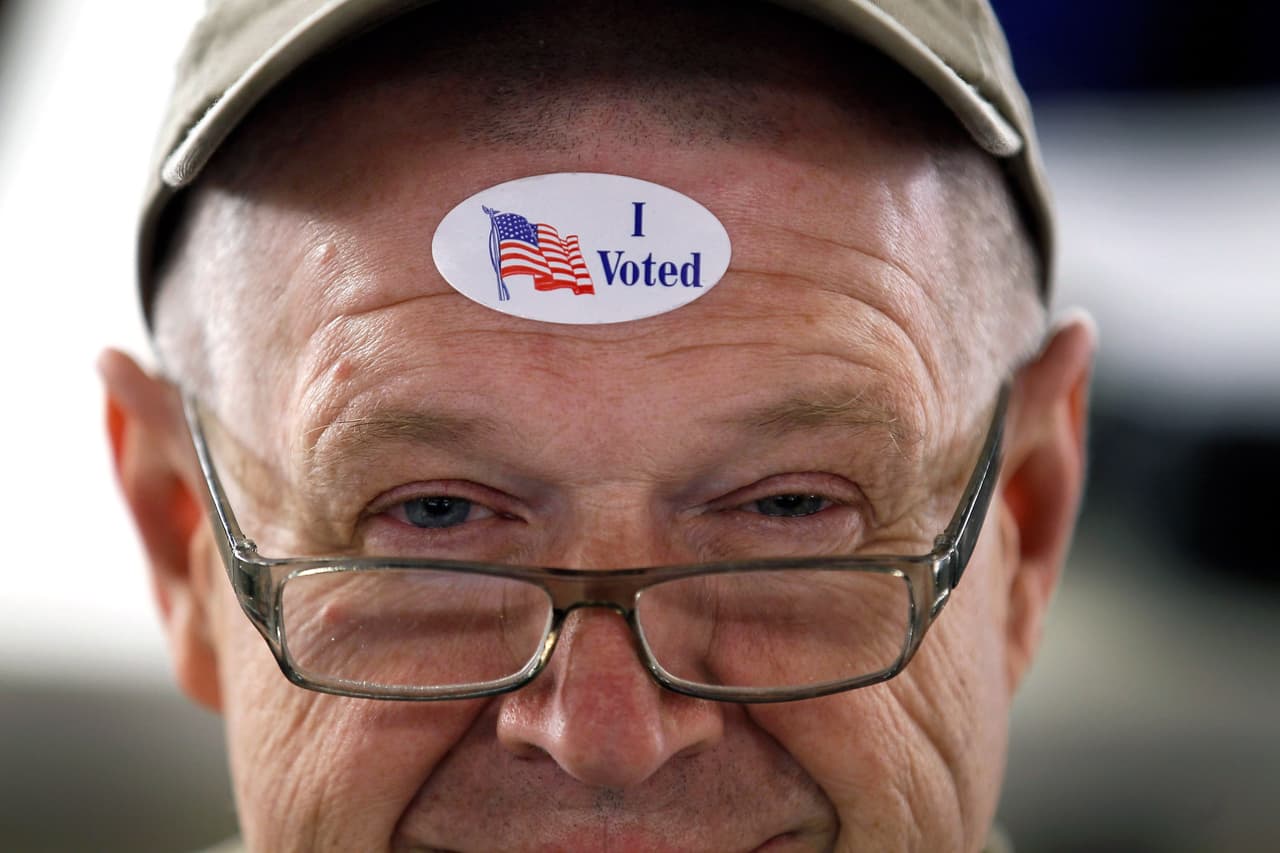 ROYAL OAK, MI - FEBRUARY 28: John Vandermark wears his " I Voted" sticker after voting on primary day as Michigan heads to the polls at Royal Oak Farmers Market on February 28, 2012 in Royal Oak, Michigan. Voters head to the polls as the Republican party continues the process of deciding who will be their general election candidate against President Barack Obama. (Photo by Joe Raedle/Getty Images)