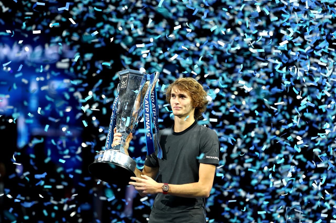 LONDON, ENGLAND - NOVEMBER 18: Alexander Zverev of Germany celebrates victory with the trophy following the singles final against Novak Djokovic of Serbia during Day Eight of the Nitto ATP Finals at The O2 Arena on November 18, 2018 in London, England. (Photo by Clive Brunskill/Getty Images)