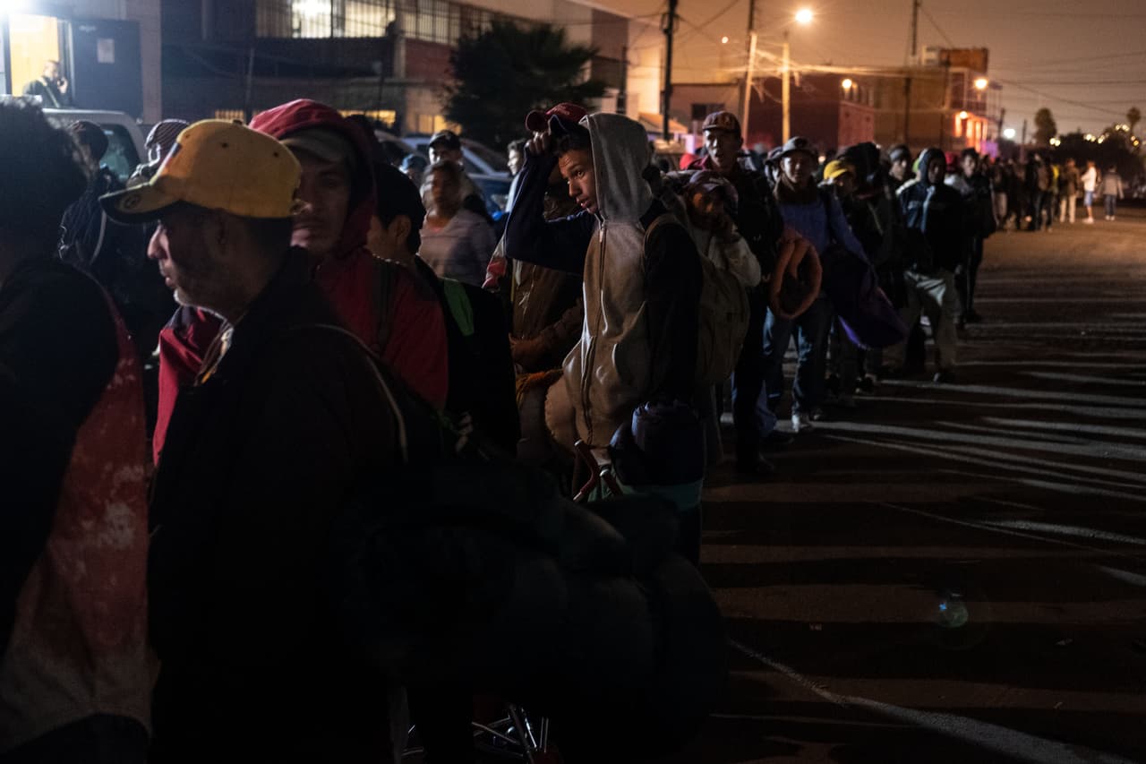 Central American migrants - mostly from Honduras - moving towards the United States in hopes of a better life, queue to enter a shelter near the US-Mexico border in Tijuana, Baja California state, Mexico, late November 20, 2018. - US President Trump has sent about 5,800 troops to the border to forestall the arrival of large groups of Central American migrants traveling through Mexico and towards the US, in a move critics decry as a costly political stunt to galvanize supporters ahead of midterm elections earlier this month. (Photo by Guillermo Arias / AFP) (Photo credit should read GUILLERMO ARIAS/AFP/Getty Images)
