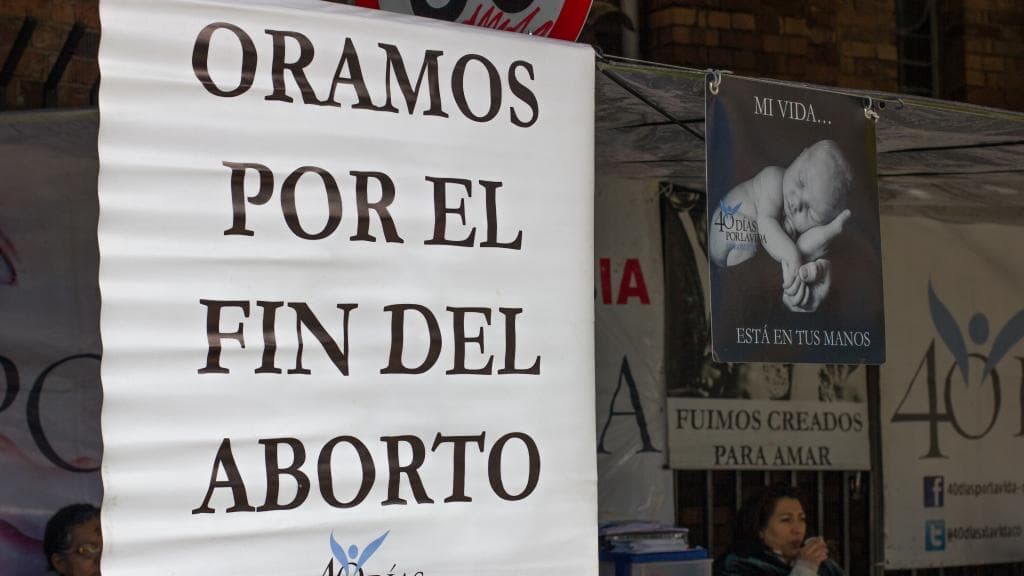 40 Days for Life signs strung up outside of the Santa Ana Catholic Church across the street from the Oriéntame clinic.
