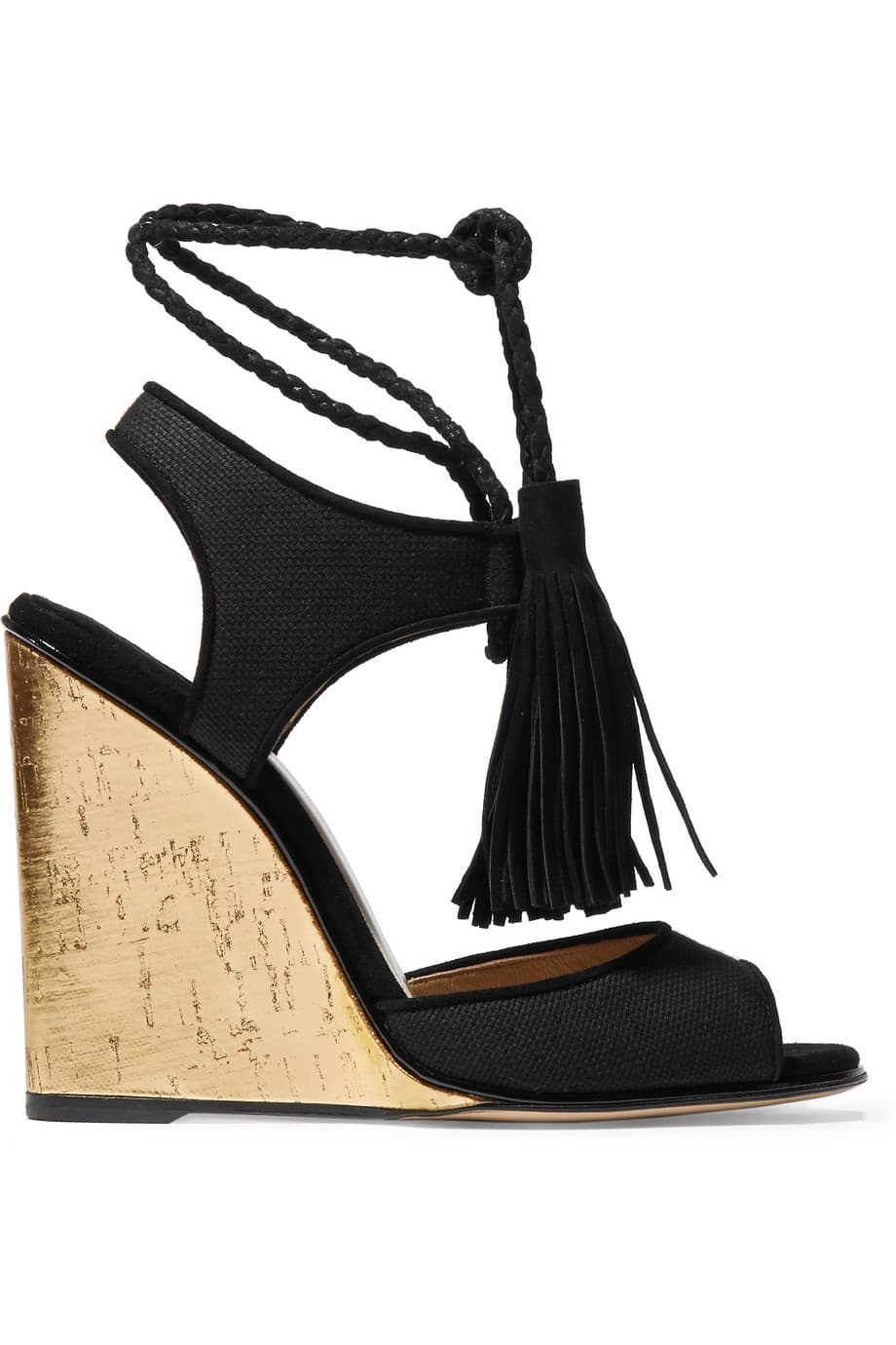 Estas plataformas de tacón cuña y gamuza con flecos, de Paul Andrew son ideales para llevar con mini o maxi vestidos florales. Son un verdadero adornos para tus pies.