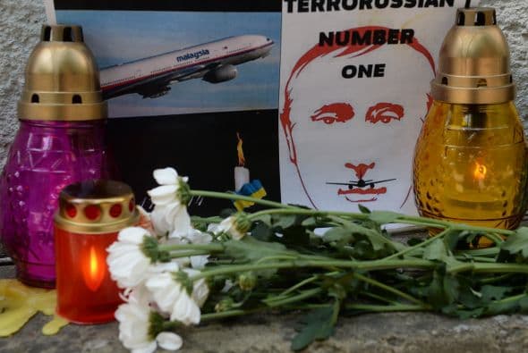 También aparecieron algunos mensajes que consignaban la tragedia, como este cartel que representa al presidente ruso, Vladimir Putin.