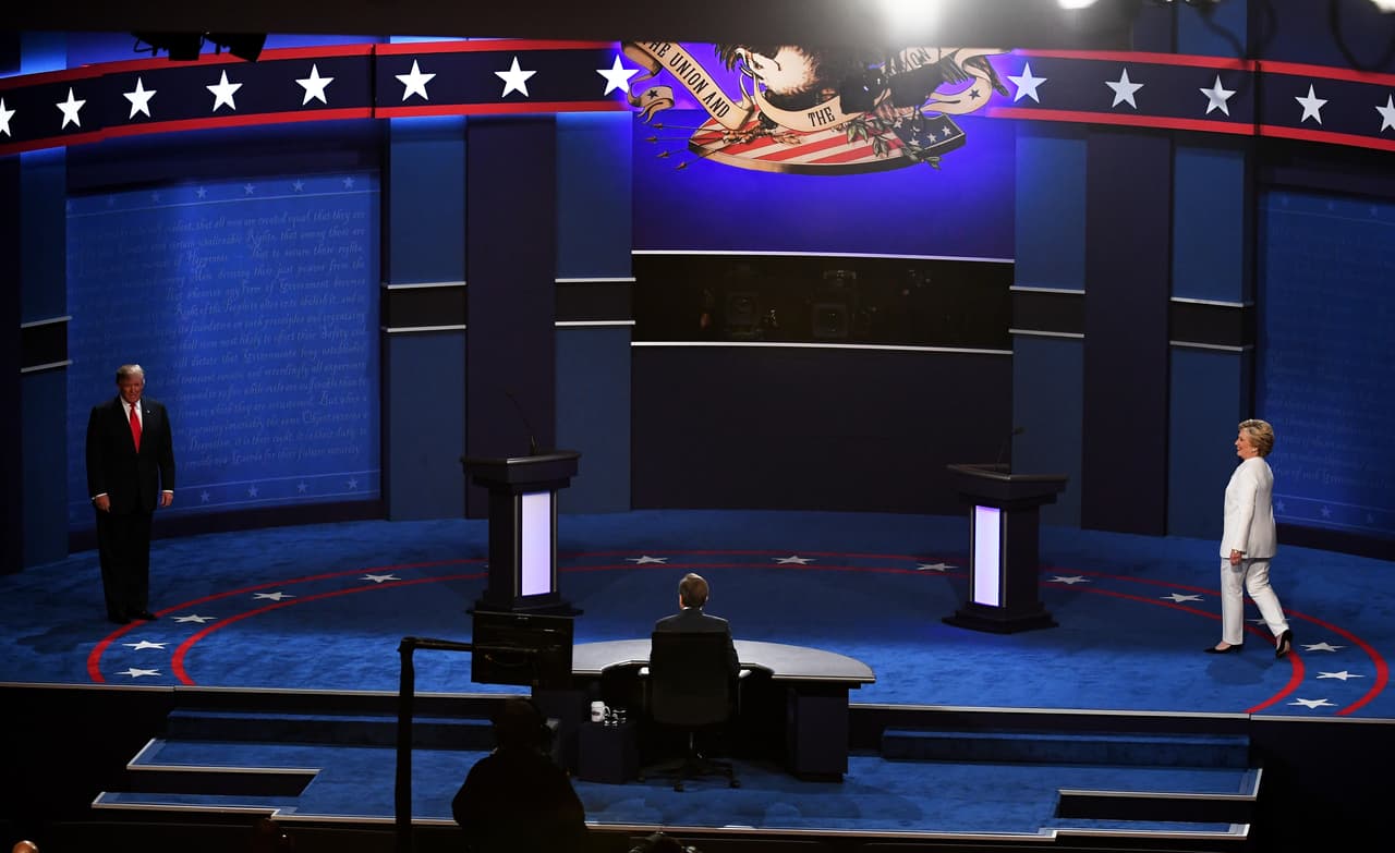 LAS VEGAS, NV - OCTOBER 19: Democratic presidential nominee former Secretary of State Hillary Clinton (R) and Republican presidential nominee Donald Trump (L) walk onto the stage during the third U.S. presidential debate at the Thomas & Mack Center on October 19, 2016 in Las Vegas, Nevada. Tonight is the final debate ahead of Election Day on November 8. (Photo by Ethan Miller/Getty Images)